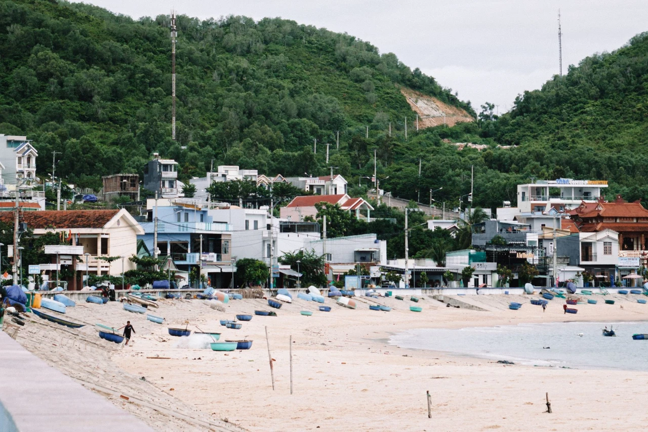 Fishing boats on a quiet beach in a coastal village near Quy Nhon, Vietnam